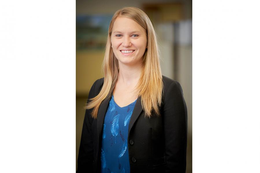 Vanessa Krahn stands smiling and posing for the camera.