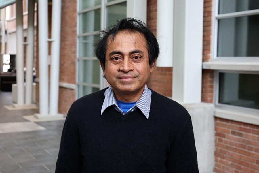 Mashiur Rahman smiling for the camera