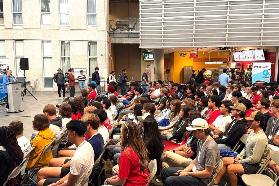 Dean giving speech in atrium