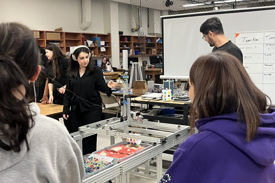 Lady moving rover driver in starlab