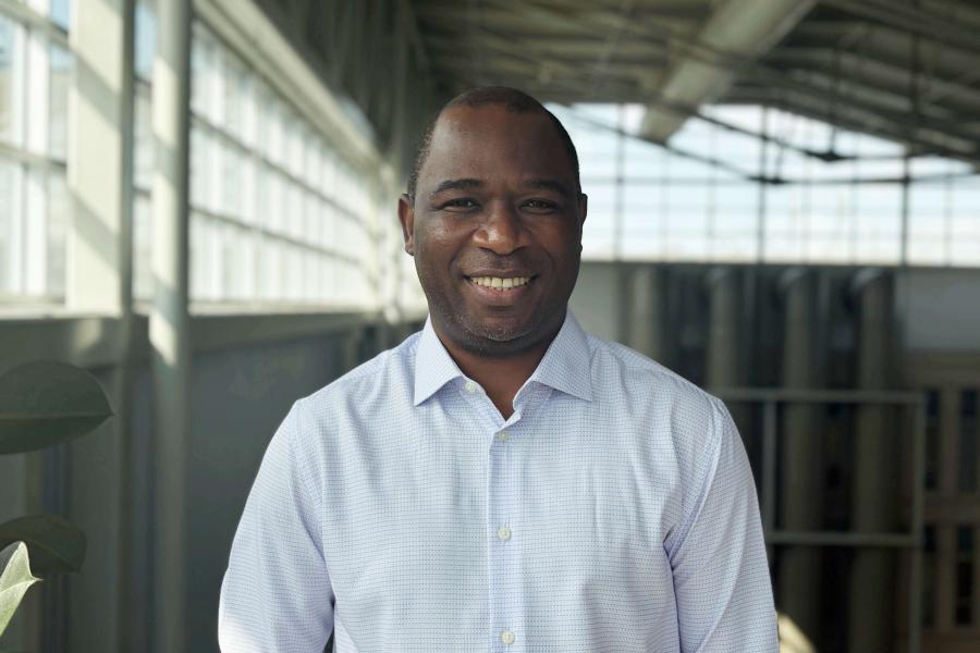 Man smiling in bright indoor space