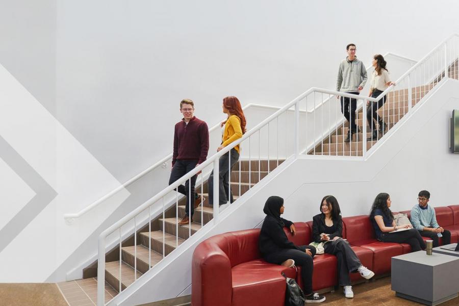 Drake Centre atrium with students on the staircase.