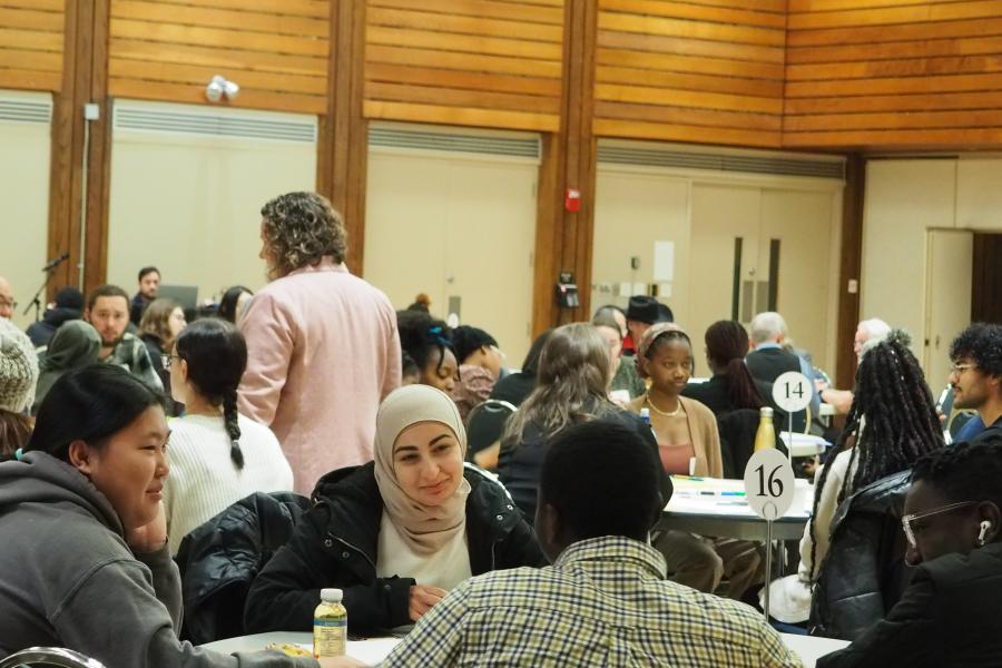 A group sitting at a table talking at Better Together 2023