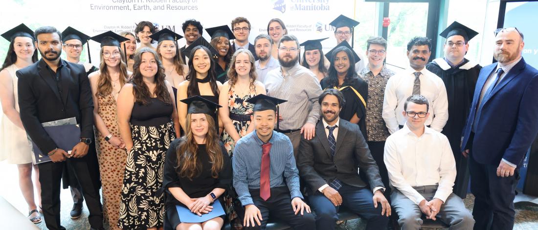 About 25 Riddell Graduates, group shot in Cretaceous Menagerie