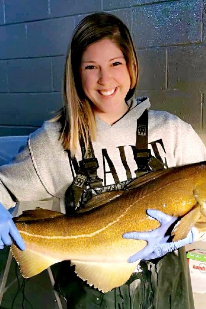 Rebecca Eldridges holds a large Atlantic cod