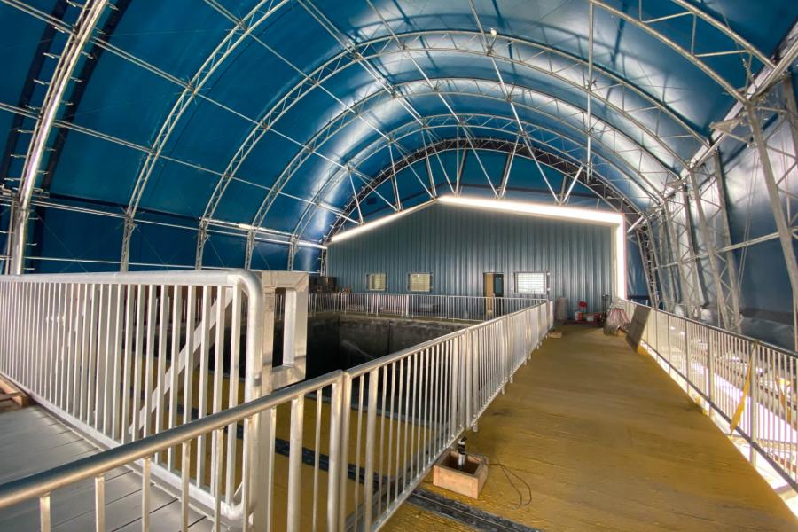 The interior of the Churchill Marine Observatory, an open space with guardrails and a blue ceiling.