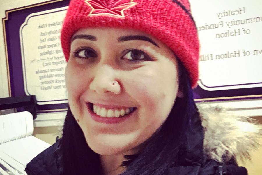 Jackie edelson wearing red toque with canadian maple leaf and a parka.