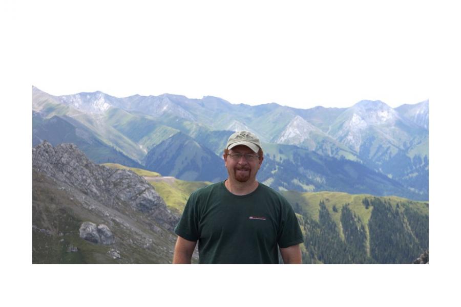 Mostafa fayek outdoors with mountains behind him.