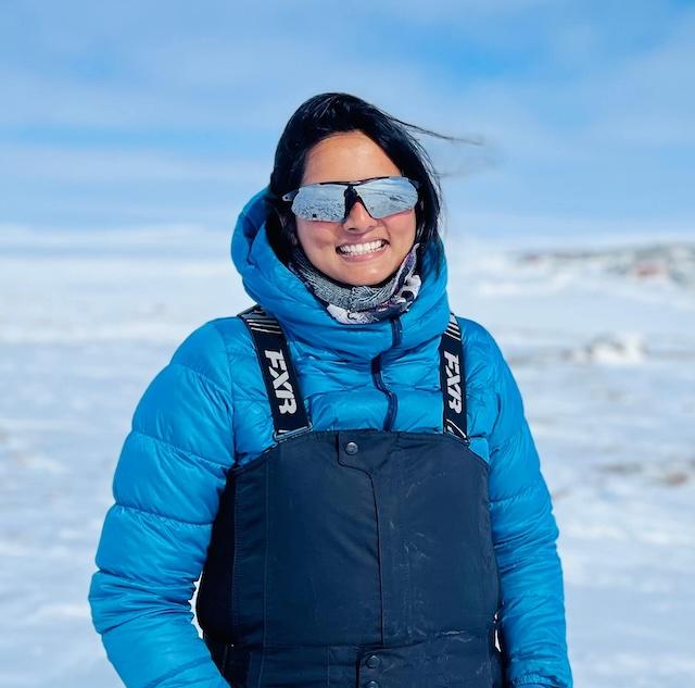 Fowzia Ahmed smiles on the ice in her arctic gear