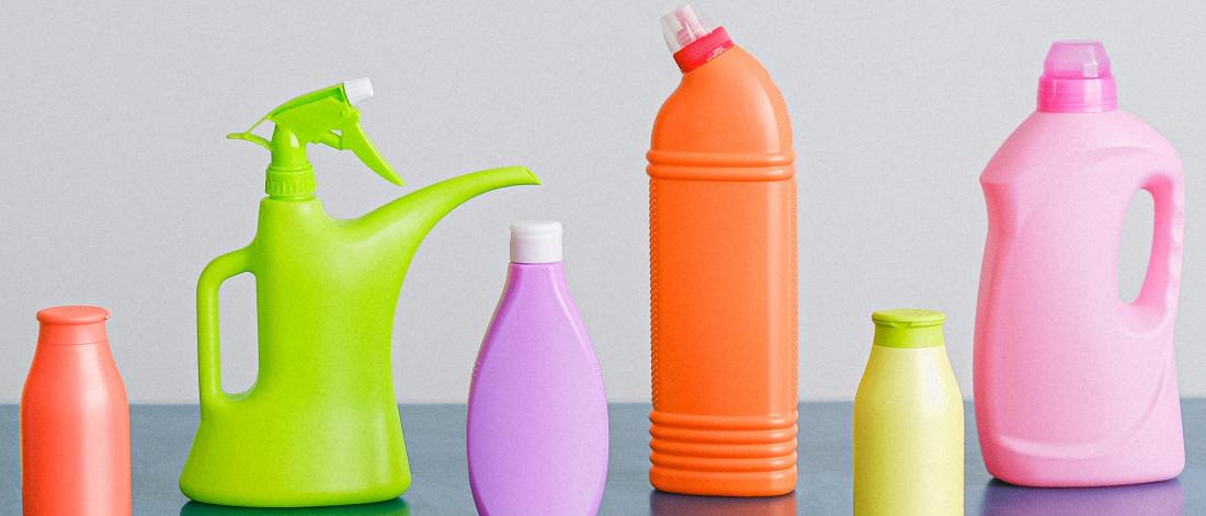 Colourful chemical bottles lined up in a row. 