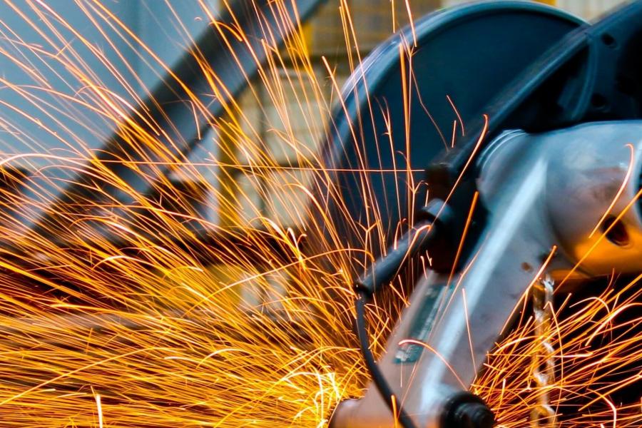 Sparks flying from saw. 