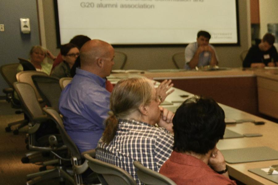 People sitting around conference table.