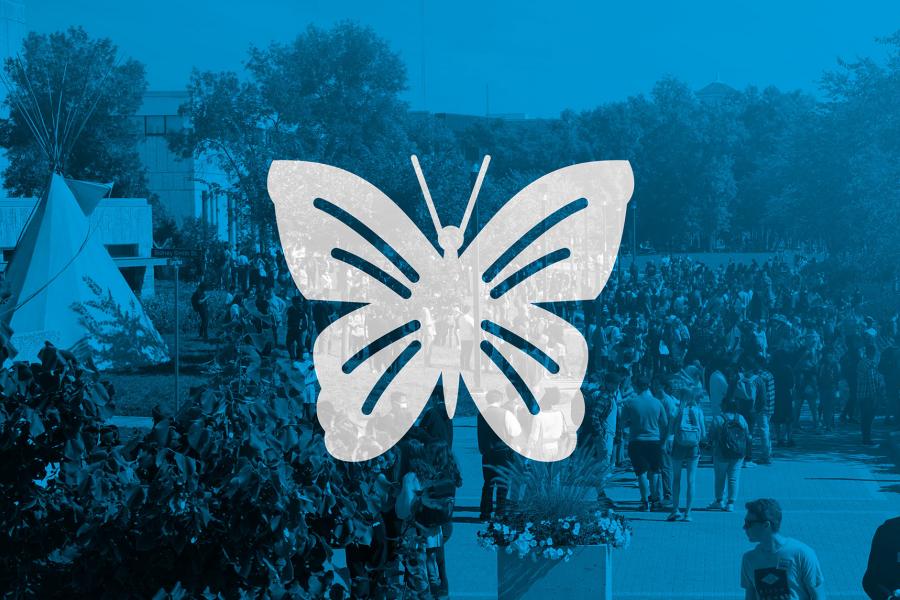 Illustration of a butterfly on a blue background with hundreds of people moving about and engaging with each other on the Fort Garry campus.