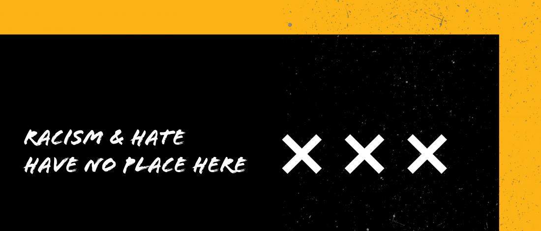 the words "racism and hate have no place here"