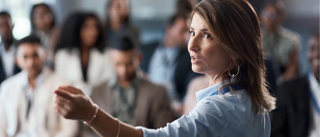 Woman at the front of a classroom