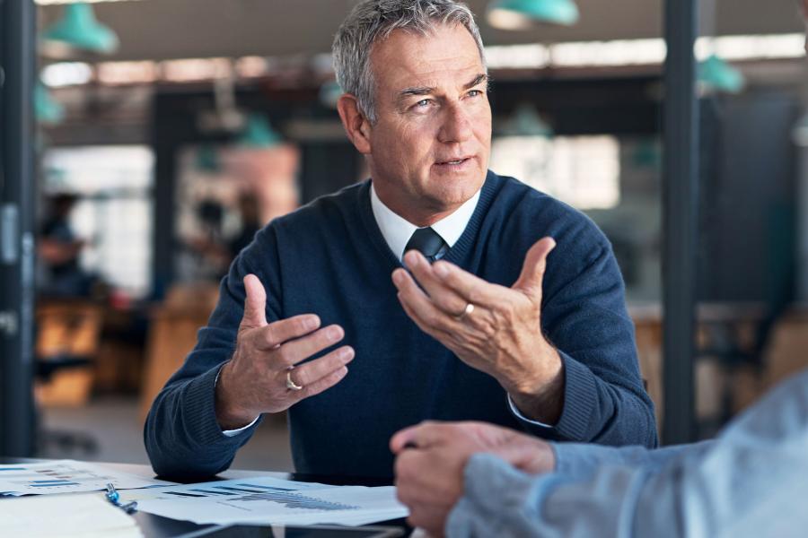 Businessmen discussing financial statements