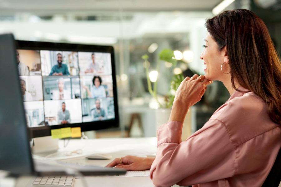 Woman looking at a computer doing virtual training