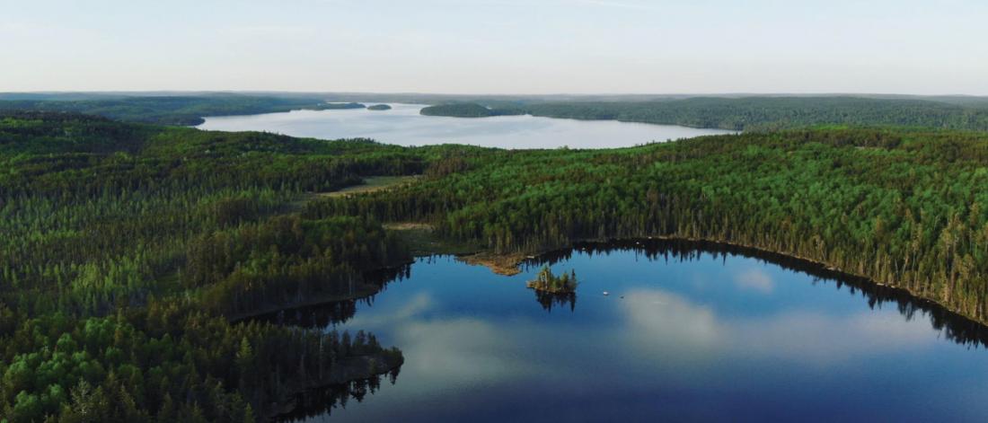 A scenic landscape of small lakes surrounded by forest. 