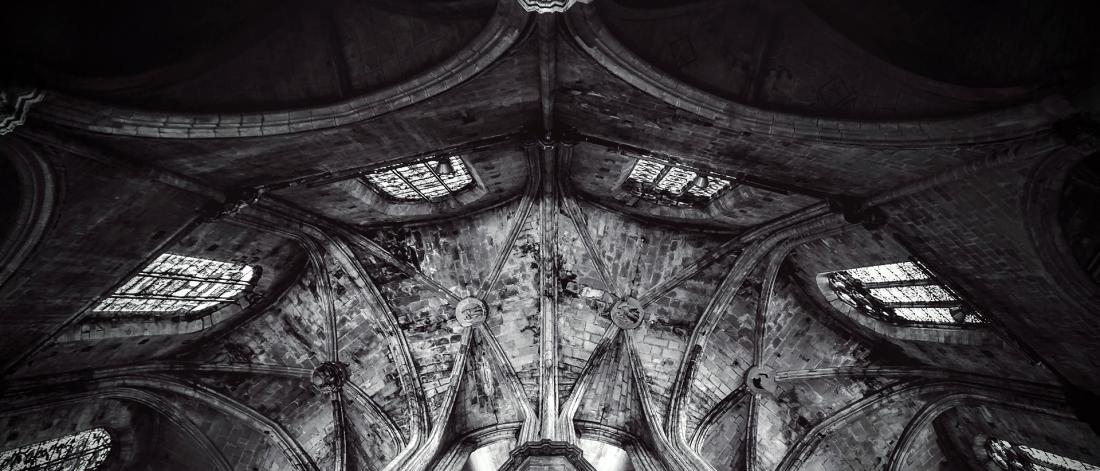 Black and white image of church ceiling.