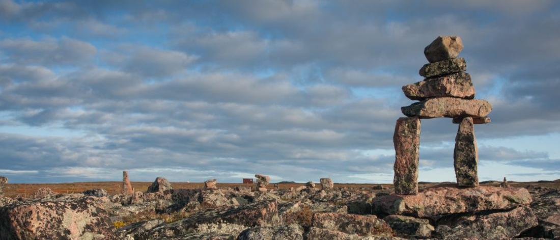 Rock formations set against a cloudy sky.