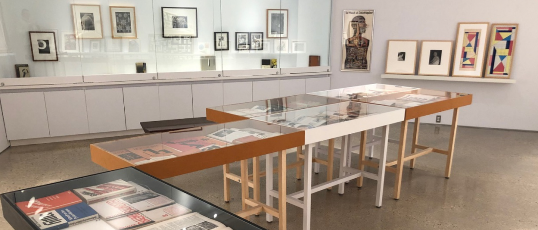 Art work displayed in table displays in the centre of the collections gallery