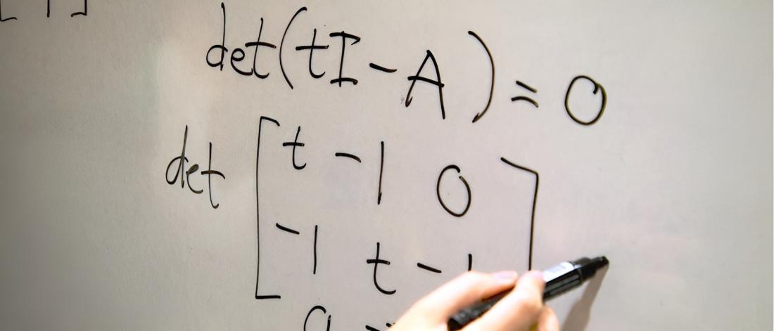 A mathematical equation on the board.