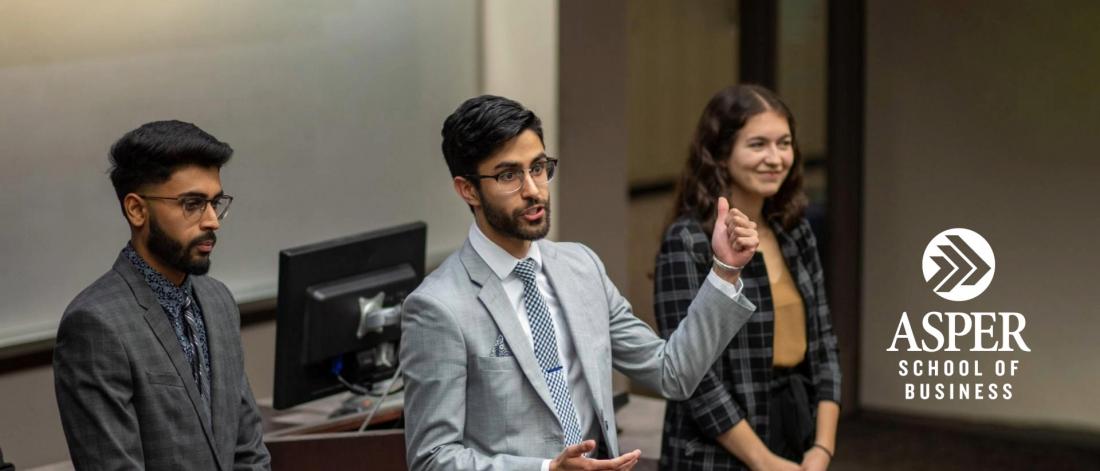 Image of a student group presenting in the classroom.