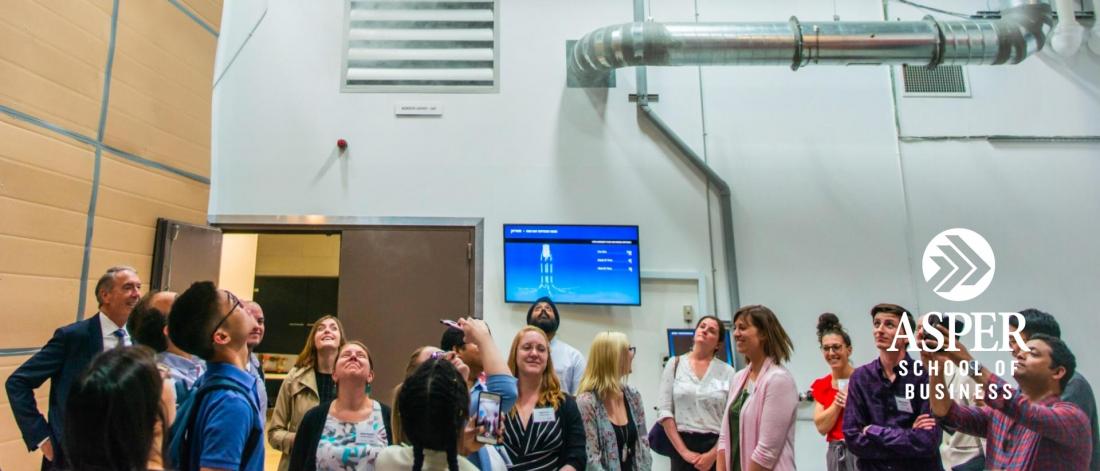 Students at a class trip visiting a local supply chain facility.