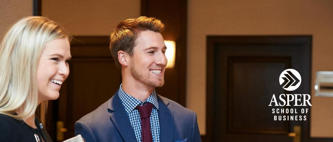 Image of two students smiling.