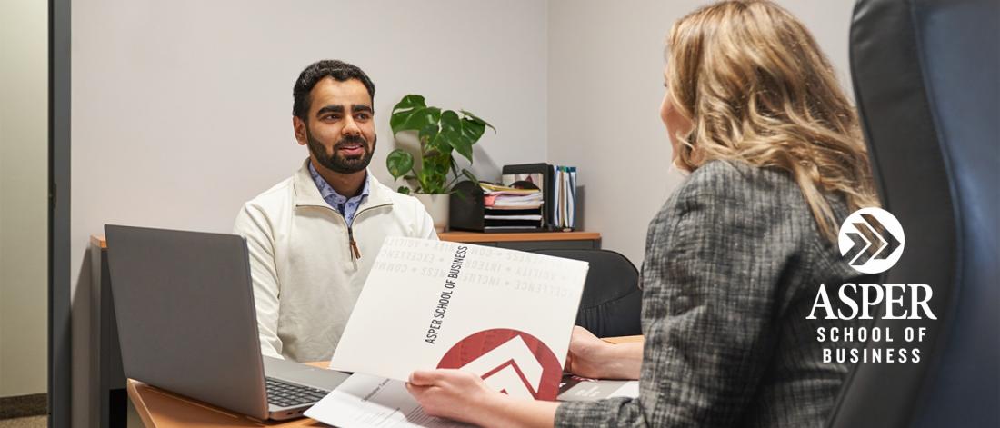 Asper student meeting with staff.