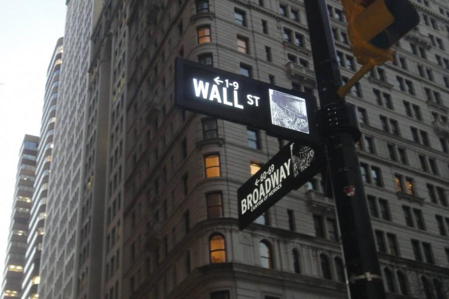 A street sign at the corner of Wall St. and Broadway.