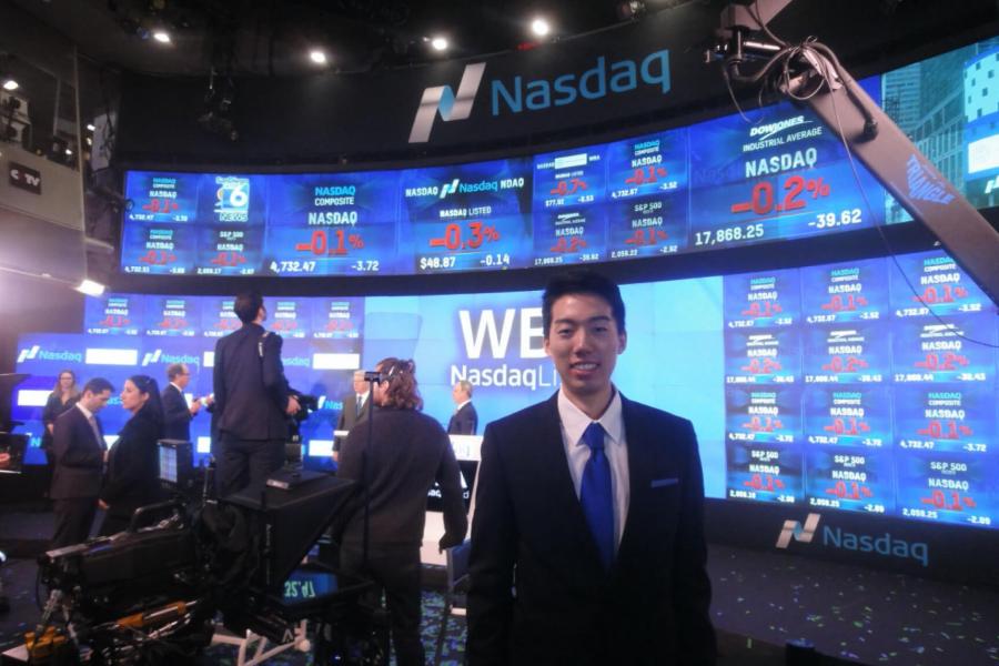 A student stands inside Nasdaq.