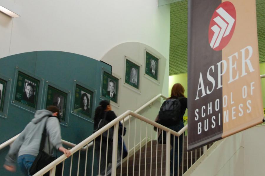 Students walk up the stairs at the Drake Centre.