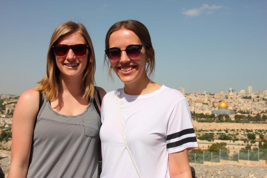 Two students stand together during an international exchange.