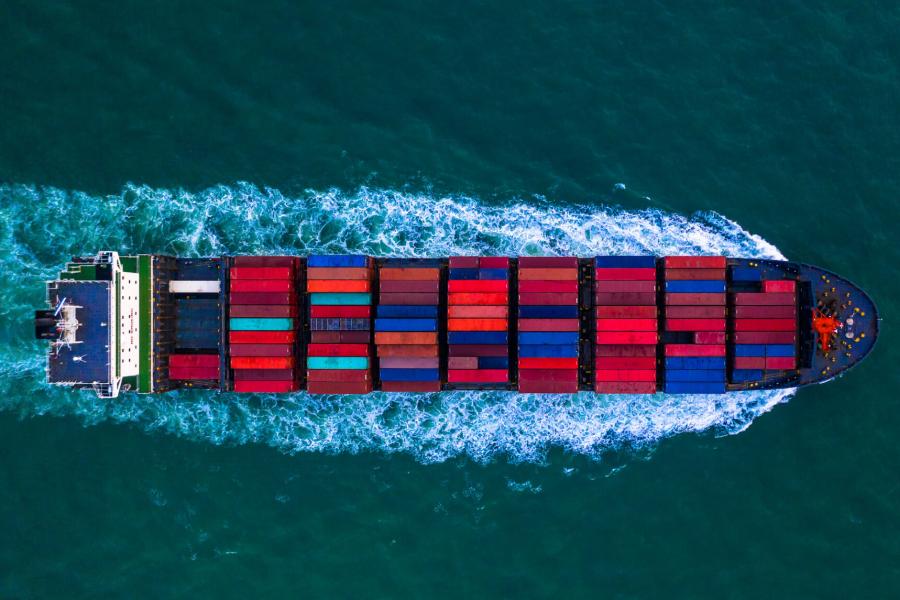 A large container ship moving through the water.