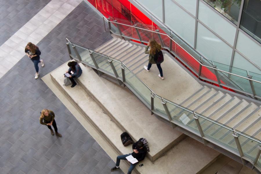 An aerial view inside the Engineering complex with students moving throughout the atrium. 