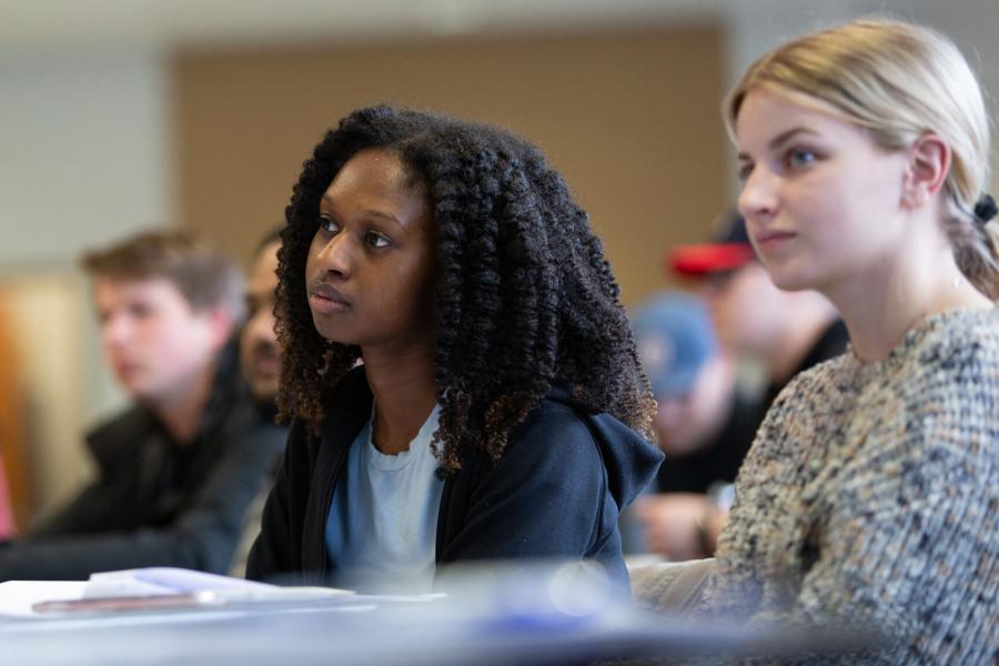 Two engineering students seated in a classroom. 