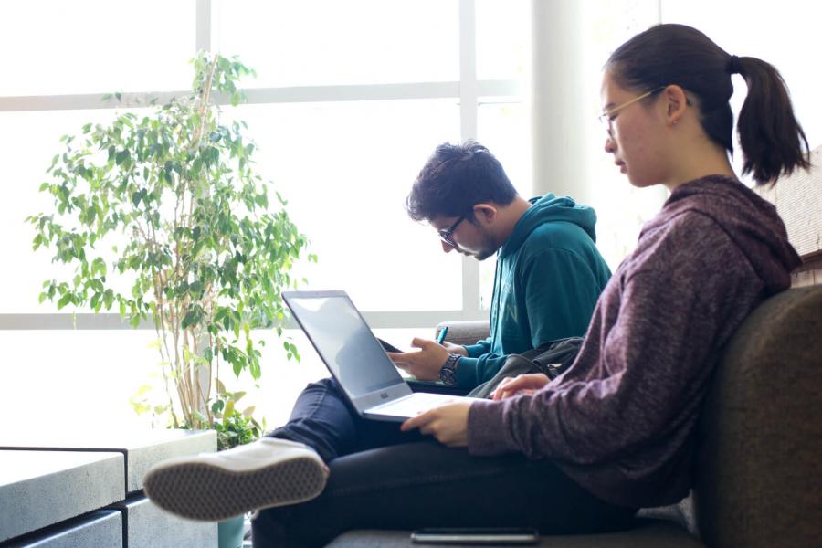 Engineering students seated in a lounge area. 