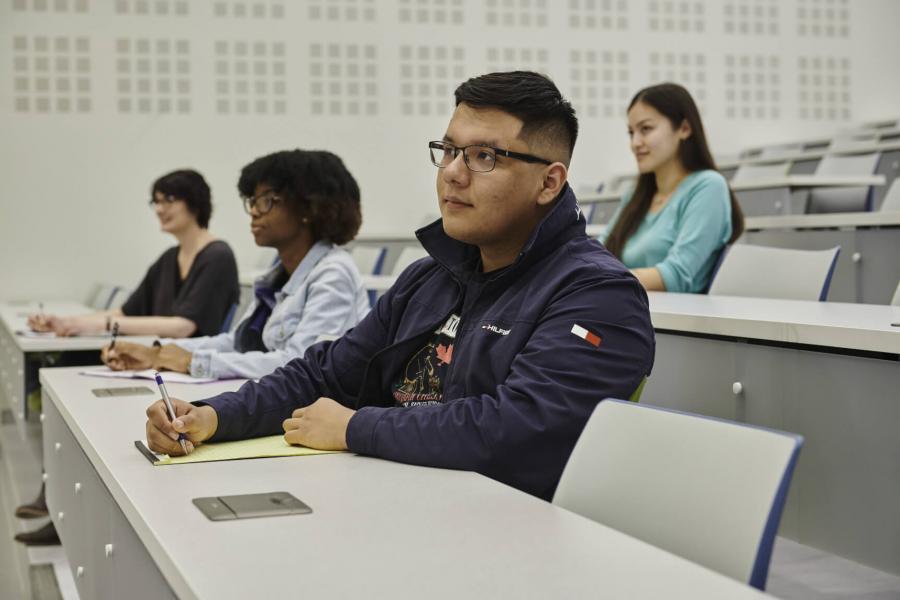 Several students seated in a classroom. 