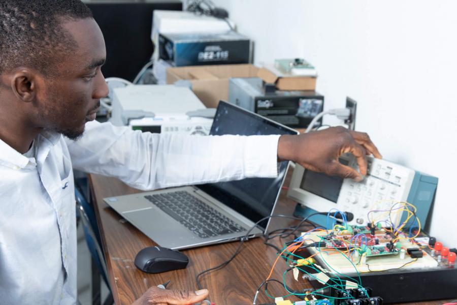 An electrical engineering student works in a lab.