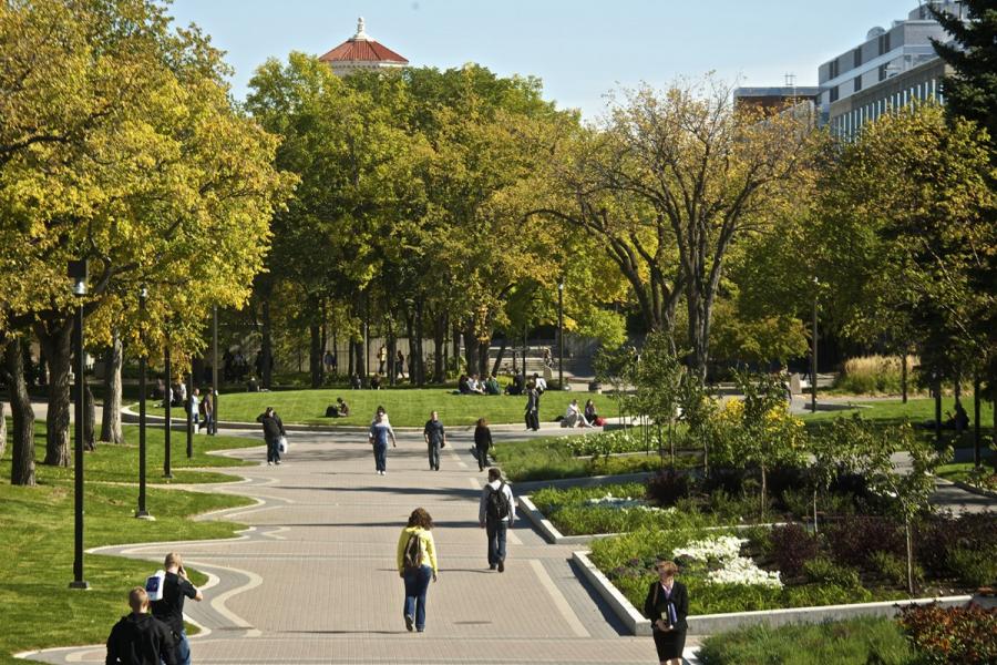 Students walk outdoors at the University of Manitoba Fort Garry campus.