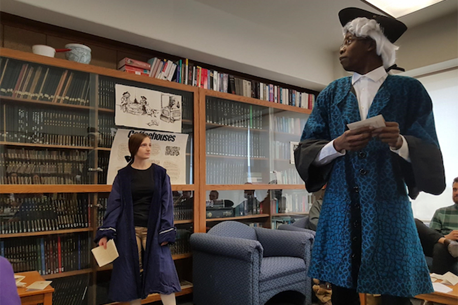 Faculty of arts student in a coffeehouse skit.