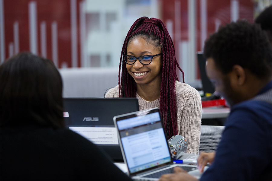 A group of student studying in Elizabeth Dafoe Library.