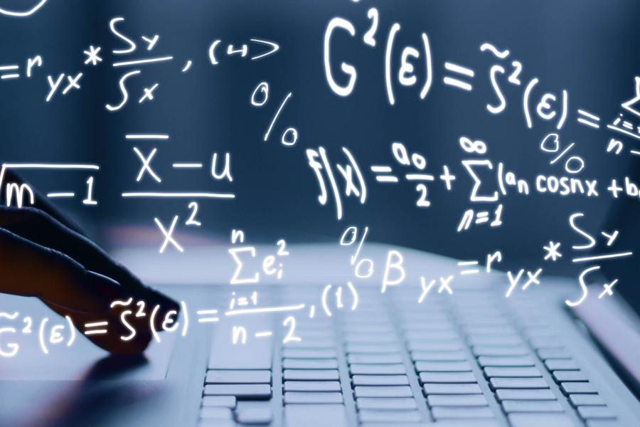 A pair of hands type on a laptop keyboard. Handwritten math equations are imposed over the image.