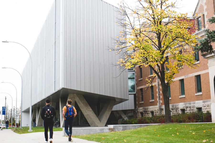 Students walking outside by the Asper and Art Lab on UM's Fort Garry Campus.