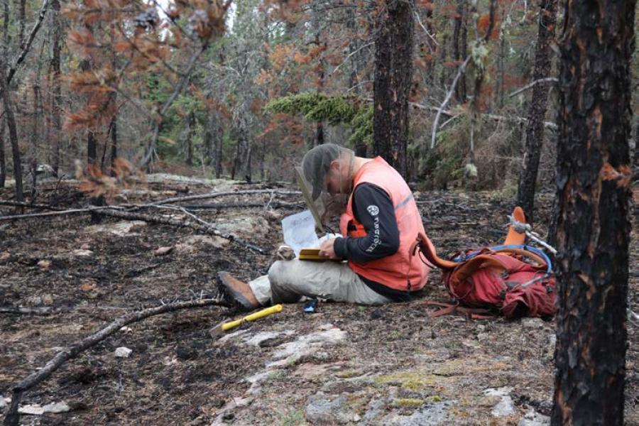 Earth science graduate student doing field work