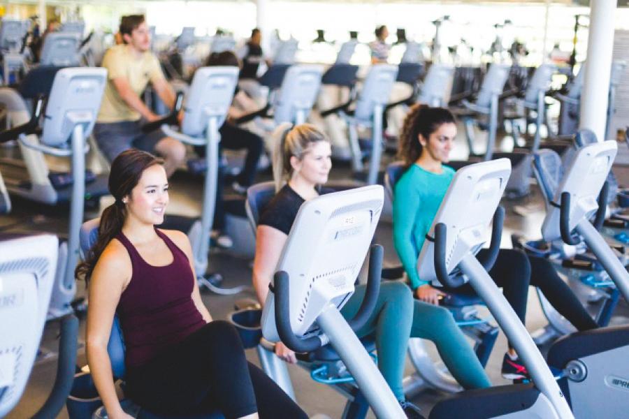 An image of a few people in UM's Active Living Centre, using some workout equipment.