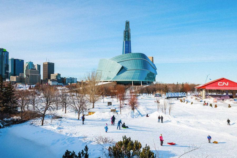 Winnipeg's skyline from The CN Stage at The Forks, showing the Winnipeg sign, the Canadian Museum for Human Rights and downtown Winnipeg.