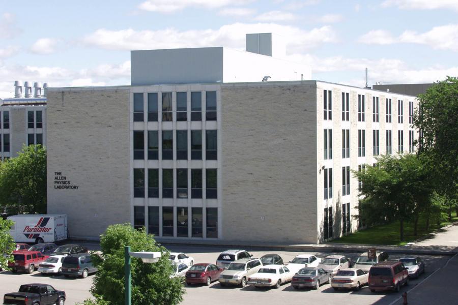 An outside view of the square, brick building University of Manitoba building labelled Allen Physics Laboratory.
