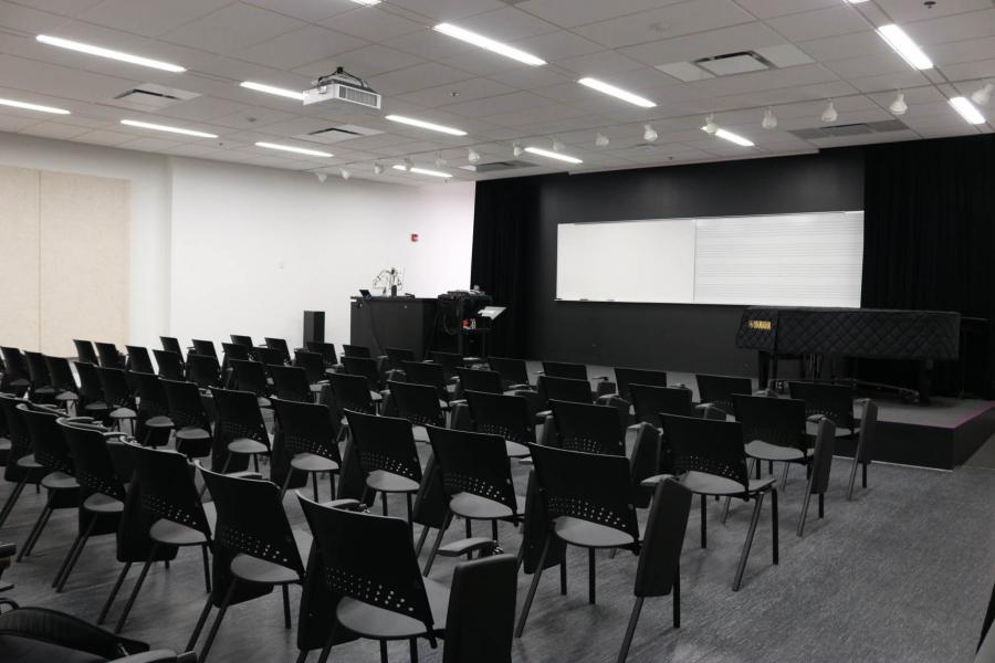 A black and white lecture hall at the Taché Arts Complex.